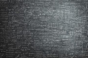 chalkboard full of mathematical problems
