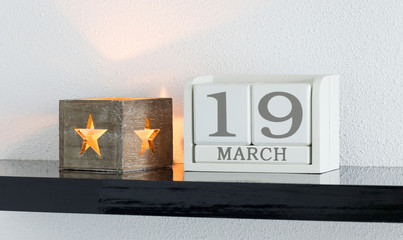 White block calendar present date 19 and month March