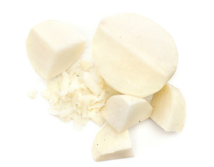 Peel black radish cut pieces and chopped stack top view isolated on white background.