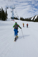 Fototapeta na wymiar Young men ski touring in the mountains
