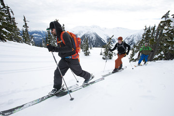 Young men ski touring in the mountains