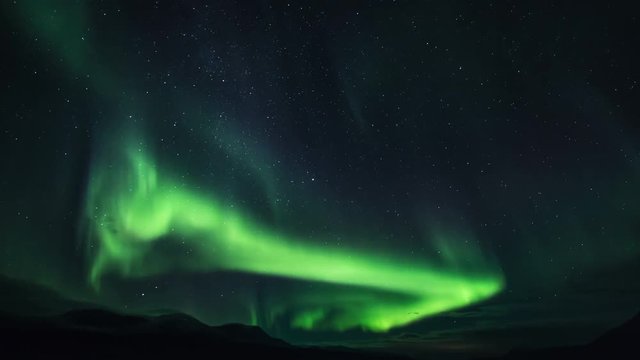 Wide timelapse, scenic aurora borealis above Norway landscape