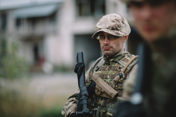 Fototapeta premium Army soldier during the military operation in the city. war, army, technology and people concept.