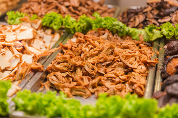 Cooked Tofu And Chicken Displayed At Street Market