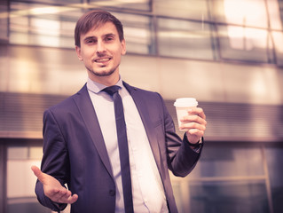 Portrait of cheerful male standing outdoor