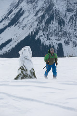 Young man ski touring in the mountains
