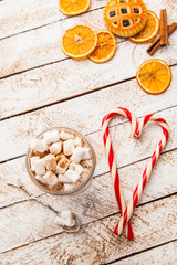 Hot cocoa with marshmallow on white rustic background. Top view