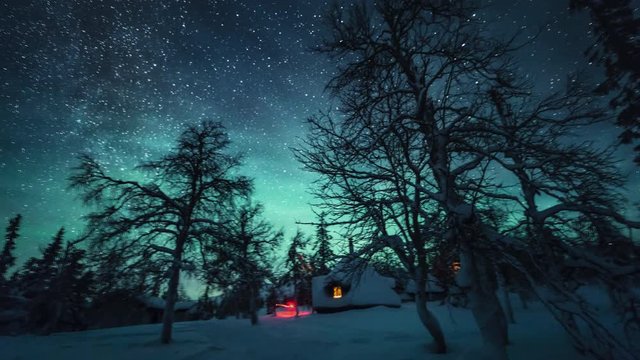 Pan right timelapse, starry sky over remote cabin