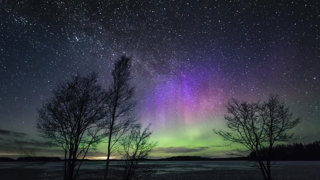 Tilt down, timelapse of northern lights in Finland