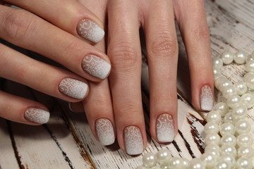 white manicure with a pattern