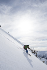 Young man skiing in the mountains