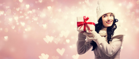 Young woman holding a Christmas gift box