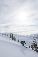 Young man skiing in the mountains