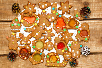 A mixture of many delicious Christmas cookies for the New Year on a wooden background. Decorative Christmas cones