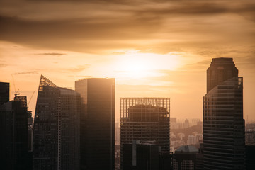 Singapore city skyline. Business district aerial view. Downtown landscape background at golden sunset in Marina Bay