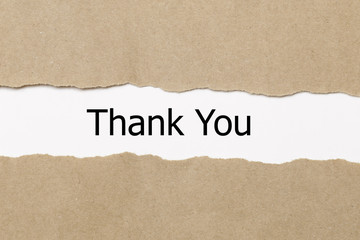 thank you word under torn paper