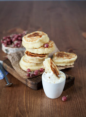 Pancakes with berries and sour cream