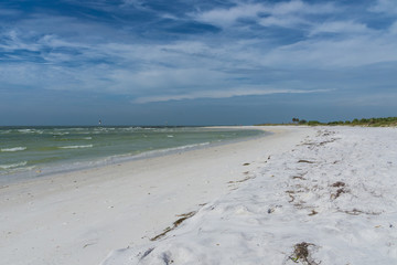 USA, Florida, Beautiful white sand beach of honeymoon island with painted sky