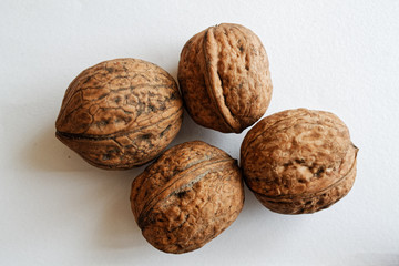 Four isolated walnut on a white background.
