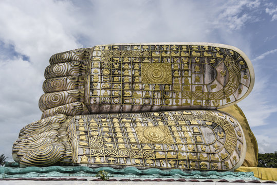 Low angle view of Mya Tha Lyaung Reclining Buddha against sky