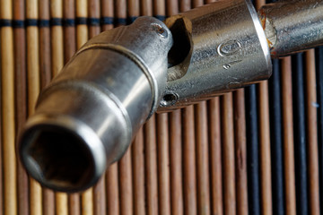 Spanner fasteners on with Torx Socket on wooden background, wrench part