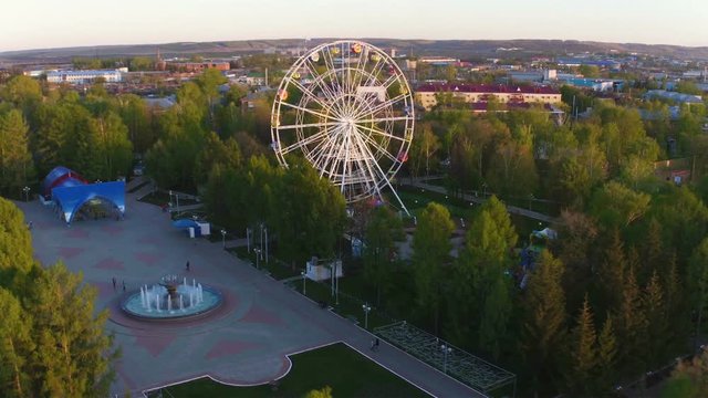 Park with Tracks and Large White Ferris Wheel Aerial View