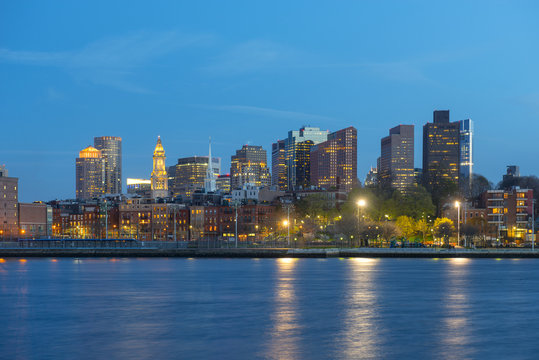 Boston City Skyscrapers, Custom House and Boston Waterfront at night from East Boston, Boston, Massachusetts, USA.