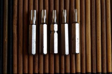 Head for screwdriver (bits) on wooden background, Tools collection turn-screw