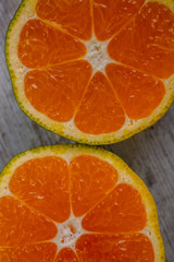 Fototapeta na wymiar tangerine on a wooden background