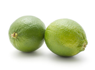 Two limes isolated on white background ripe fresh.