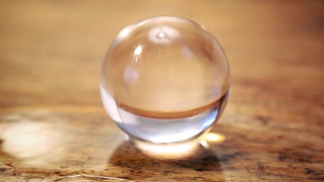 Cinemagraph of glass sphere with running water
