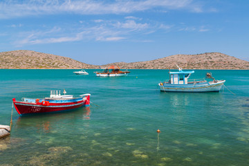 Naklejka na ściany i meble Fishing boat at the coast of Crete, Greece
