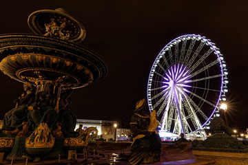 Paris, France - December 4, 2017: Ferris wheel at the Place de la Concorde  at night near champs elysees