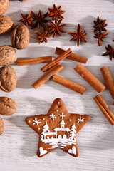 Gingerbread star poured white frosting on Christmas Eve table in a Christmas surprise for guests.
