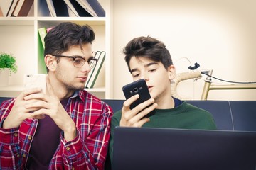 students with the computer and mobile phone at home