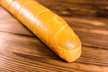 French white baguette on a wooden table