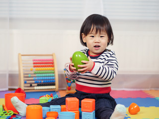 baby girl play toy at home