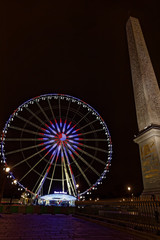 Paris, France - December 4, 2017: Ferris wheel at the Place de la Concorde  at night near champs elysees
