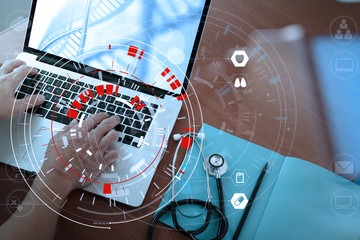 Medical technology concept,smart doctor hand working with modern computer in hospital office with virtual icon diagram
