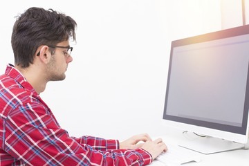 young man with computer at home