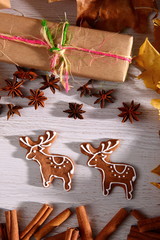 Gingerbread star poured white frosting on Christmas Eve table in a Christmas surprise for guests.
