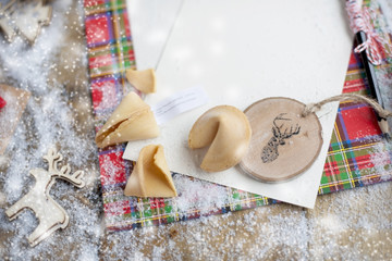 Traditional cookies with a wish in Christmas, on the table and snow