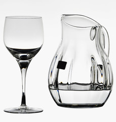Detail of a crystal goblet and an elegant carafe