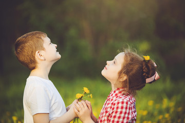 Little Boy gift flowers his friend girl