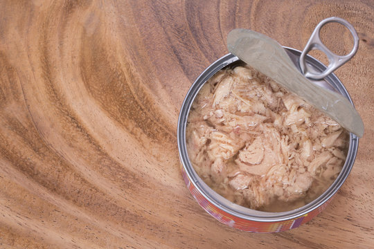 Open Can Of Tuna On The Wooden Background