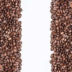 White empty copy space between coffee seeds.