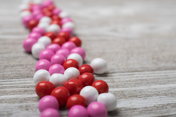 Valentines candy arranged in a line showing depth of field