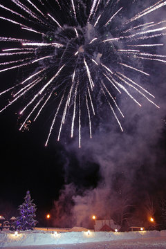 Winter landscape with fireworks
