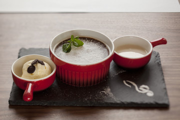 three parts souffle served on a table in a restaurant
