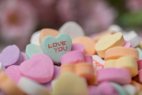 Bowl of heart  candy with focus on Love you heart piece